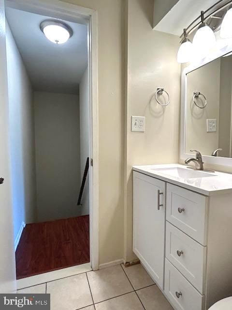 bathroom with tile patterned flooring and vanity