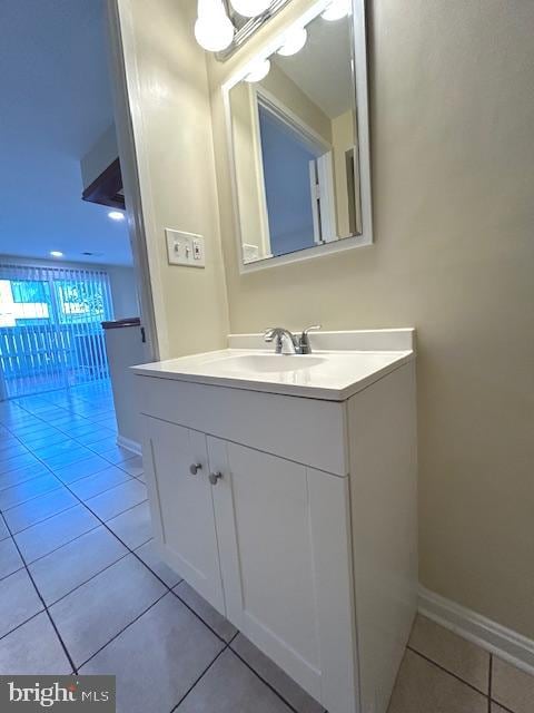 bathroom featuring tile patterned flooring and vanity