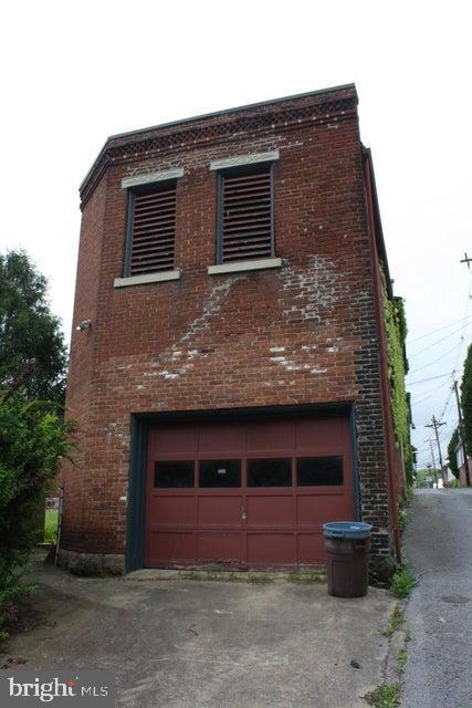 view of property exterior featuring a garage