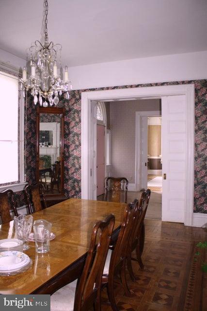 dining area with parquet floors