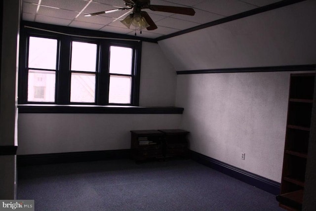 bonus room featuring ceiling fan, carpet, and lofted ceiling