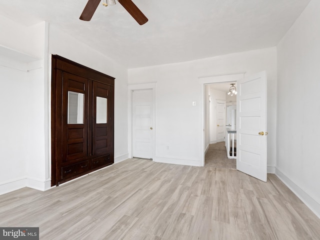 foyer featuring ceiling fan and light hardwood / wood-style flooring