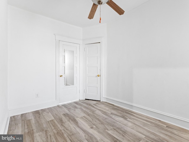 unfurnished room featuring ceiling fan and light hardwood / wood-style flooring