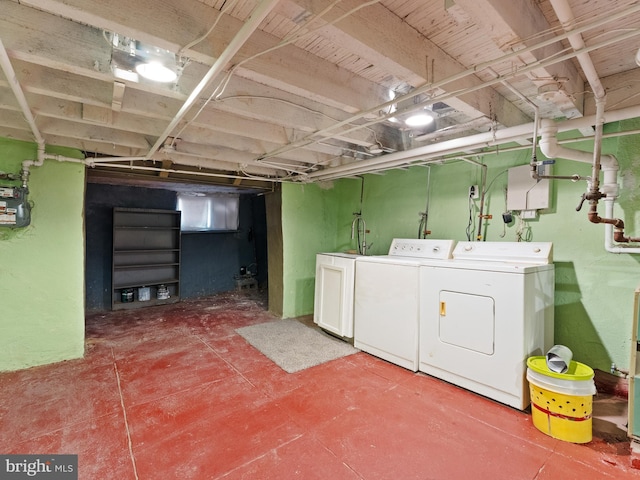 clothes washing area featuring washer and dryer