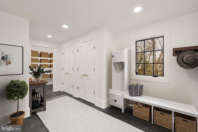 mudroom with baseboards and recessed lighting