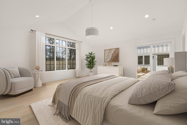 bedroom with high vaulted ceiling, multiple windows, recessed lighting, and light wood-style floors