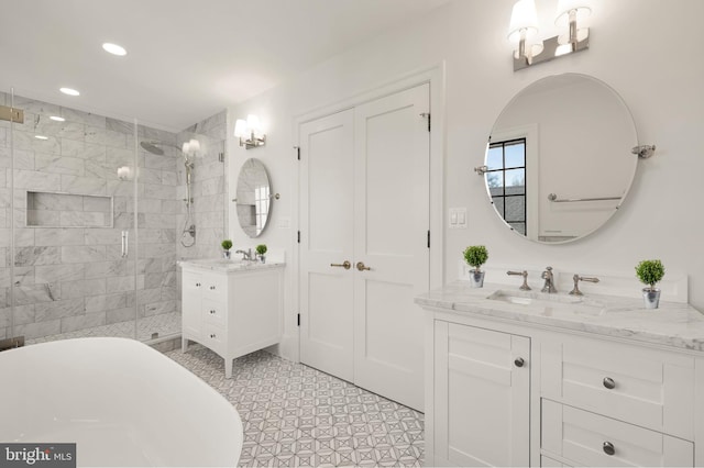 bathroom featuring recessed lighting, two vanities, a sink, and a shower stall