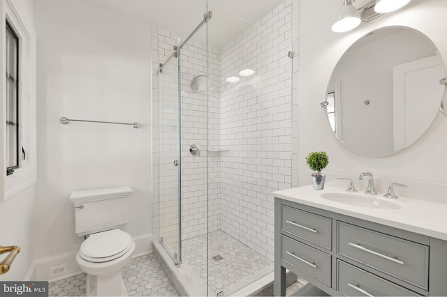 bathroom with toilet, tile patterned flooring, a shower with door, and vanity