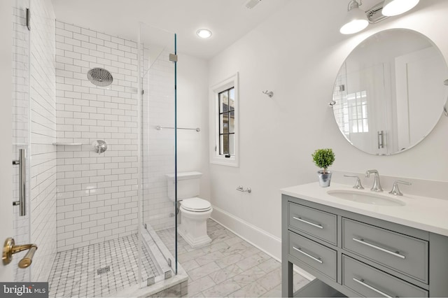 bathroom featuring an enclosed shower, vanity, and toilet