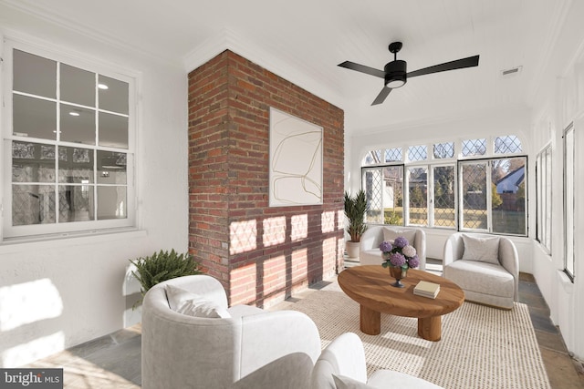 sunroom featuring ceiling fan and visible vents