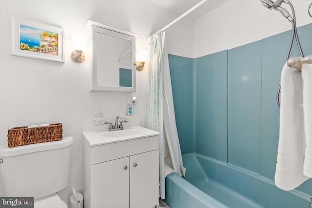 full bathroom with vanity, toilet, and shower / tub combo