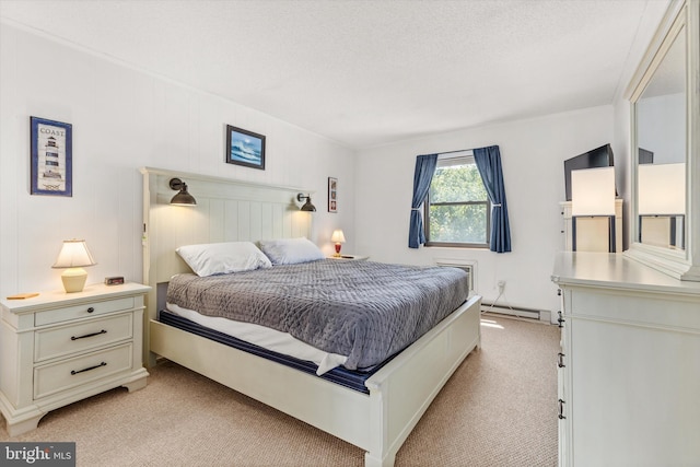 bedroom featuring a baseboard radiator, light carpet, and a textured ceiling