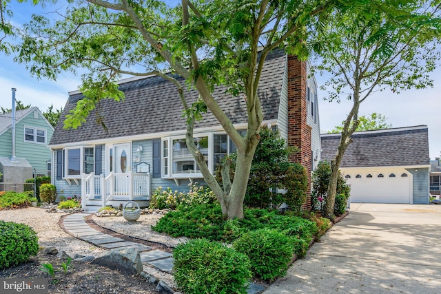 back of property featuring a garage