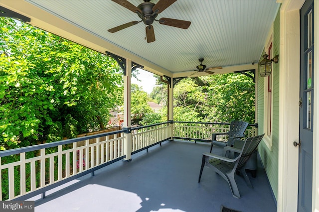 view of patio featuring a balcony and ceiling fan