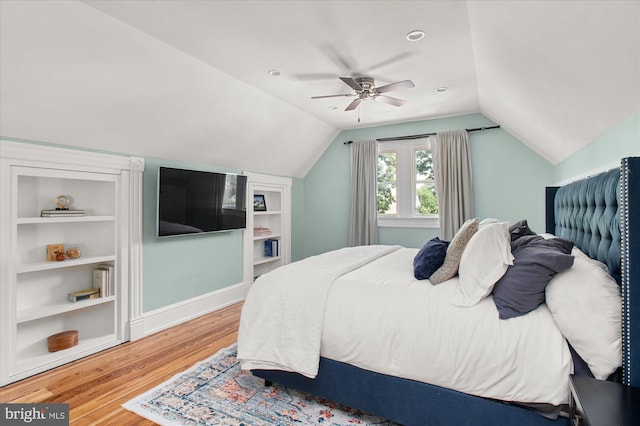 bedroom with vaulted ceiling, ceiling fan, and light hardwood / wood-style floors