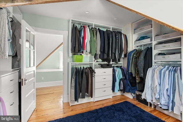 spacious closet featuring light hardwood / wood-style floors