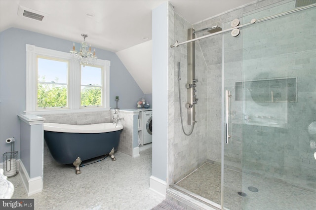 bathroom with washer / clothes dryer, tile patterned floors, independent shower and bath, and vaulted ceiling