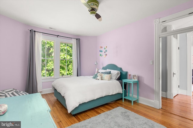 bedroom featuring light hardwood / wood-style flooring and ceiling fan