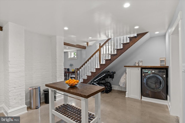 stairway featuring washer / dryer