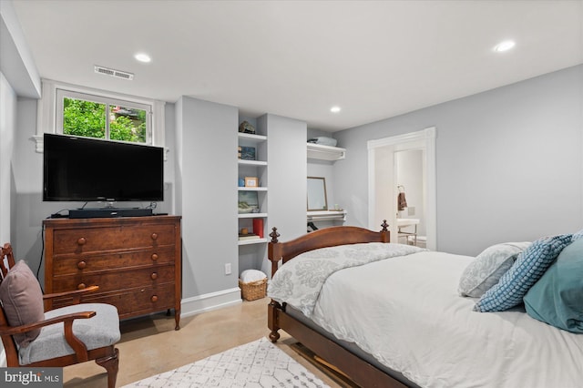 tiled bedroom featuring connected bathroom