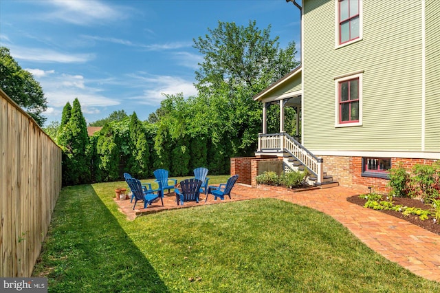 view of yard with a fire pit