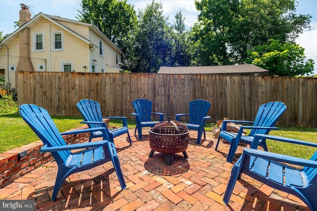 view of patio / terrace with a fire pit