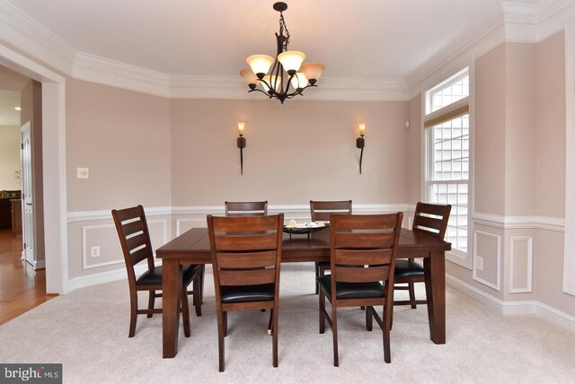 carpeted dining room featuring crown molding and a notable chandelier