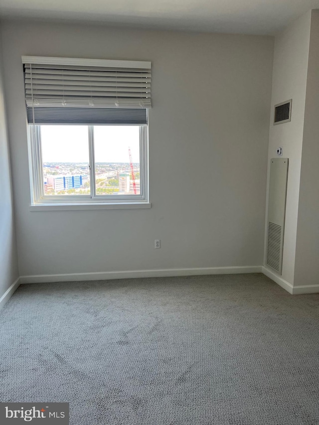 empty room featuring carpet flooring