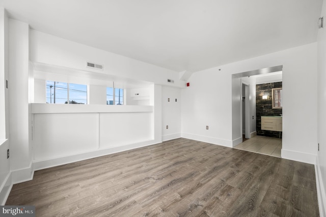 empty room featuring wood-type flooring