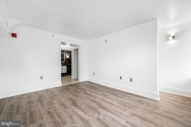 spare room featuring light wood-type flooring