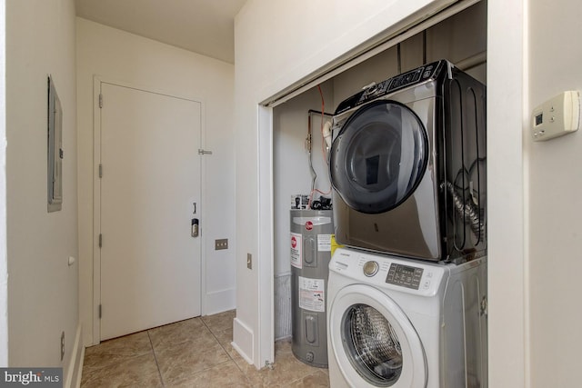 washroom with electric water heater, light tile patterned floors, stacked washer and clothes dryer, and electric panel