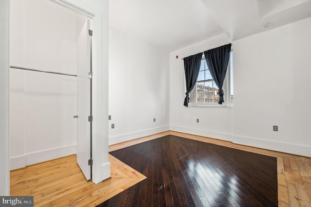 empty room featuring hardwood / wood-style flooring