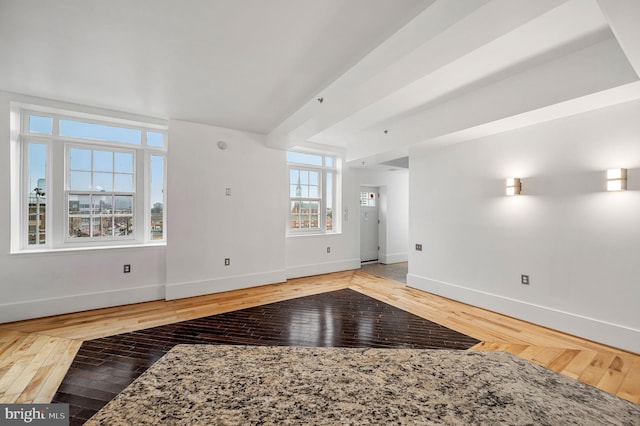 unfurnished living room featuring hardwood / wood-style floors