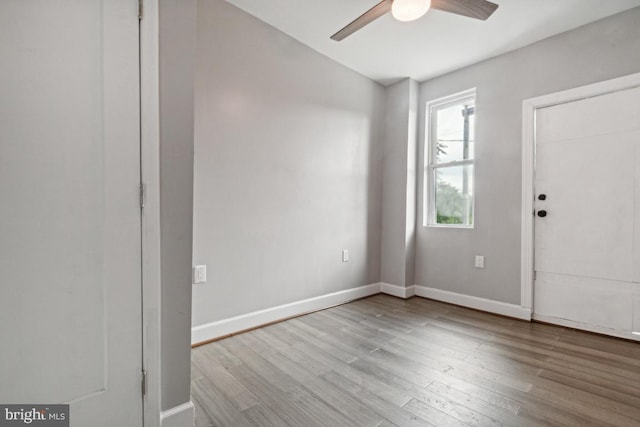 foyer entrance featuring ceiling fan and light hardwood / wood-style floors