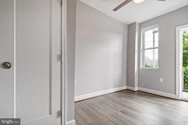 spare room with light hardwood / wood-style flooring and ceiling fan