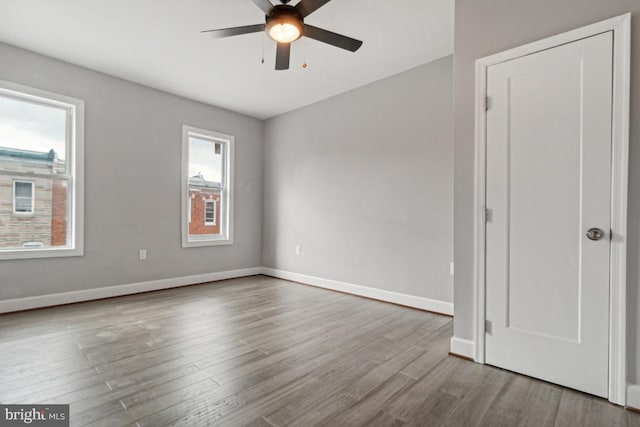 spare room with light hardwood / wood-style floors and ceiling fan