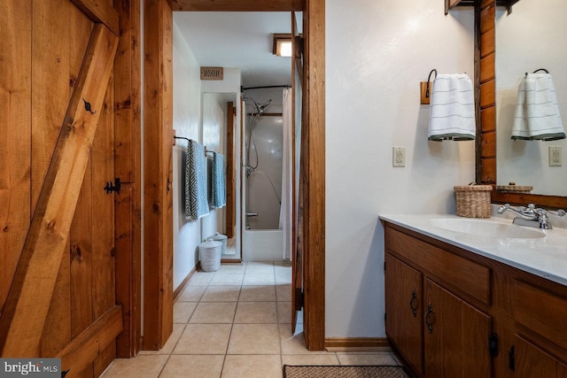 bathroom featuring shower / bath combination, tile patterned floors, and vanity