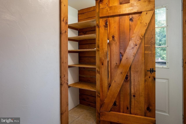 stairs featuring tile patterned flooring