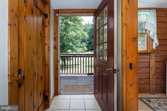 doorway featuring light tile patterned floors