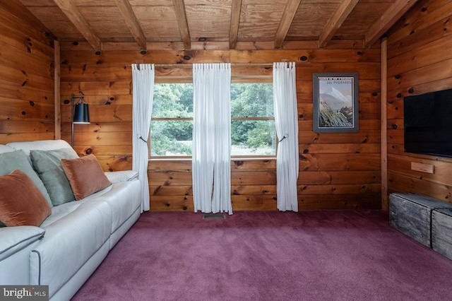 living room with carpet flooring, wood ceiling, wooden walls, and lofted ceiling with beams