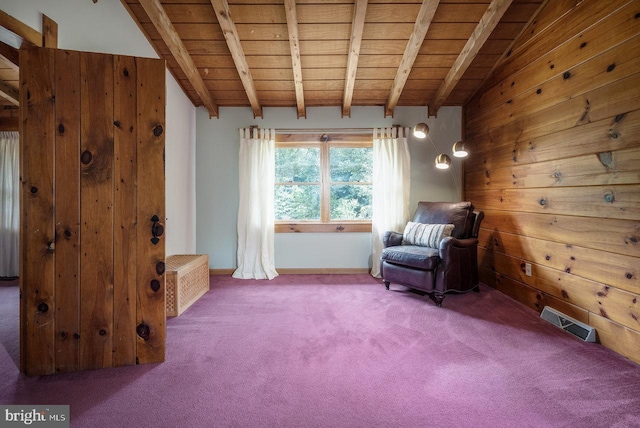 unfurnished room featuring wooden ceiling, carpet flooring, vaulted ceiling with beams, and wooden walls