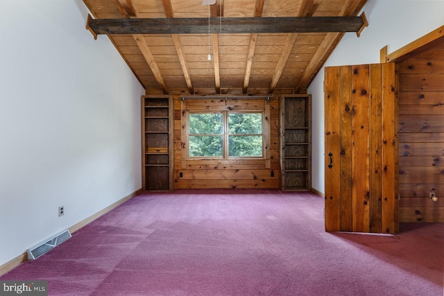 unfurnished living room with vaulted ceiling with beams, carpet flooring, wooden walls, and wooden ceiling