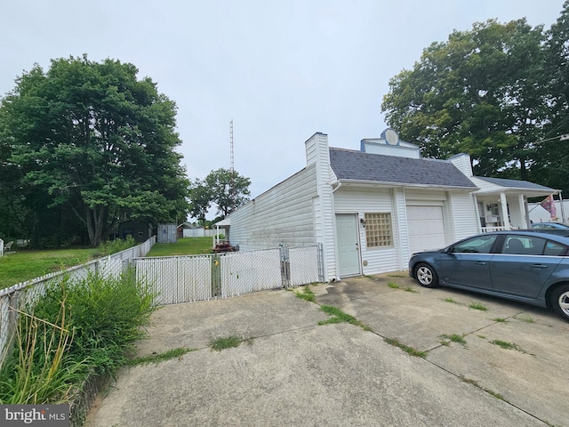 view of side of property with a garage