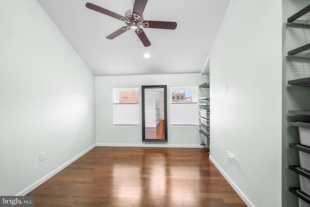 spare room with dark wood-type flooring and ceiling fan