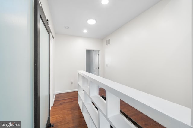 corridor with dark hardwood / wood-style floors