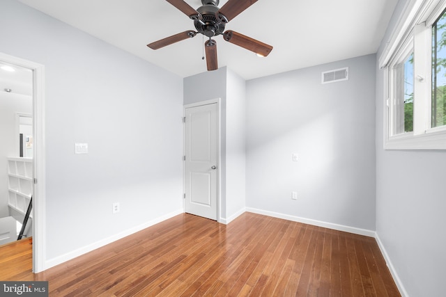 interior space with ceiling fan and hardwood / wood-style floors