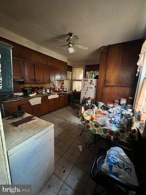 kitchen featuring ceiling fan and white fridge