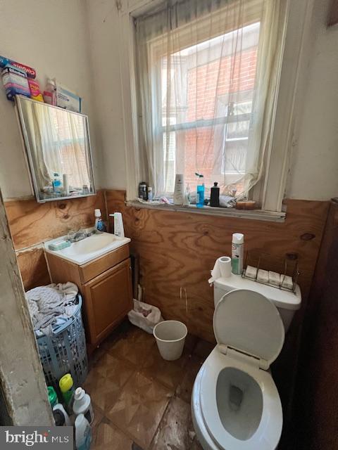 bathroom featuring toilet and vanity