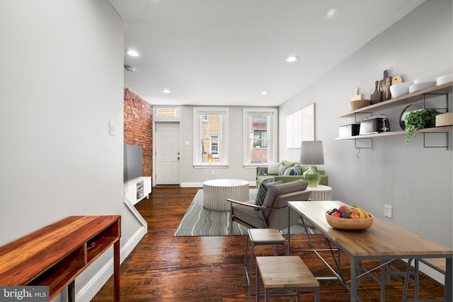 living room with dark hardwood / wood-style flooring