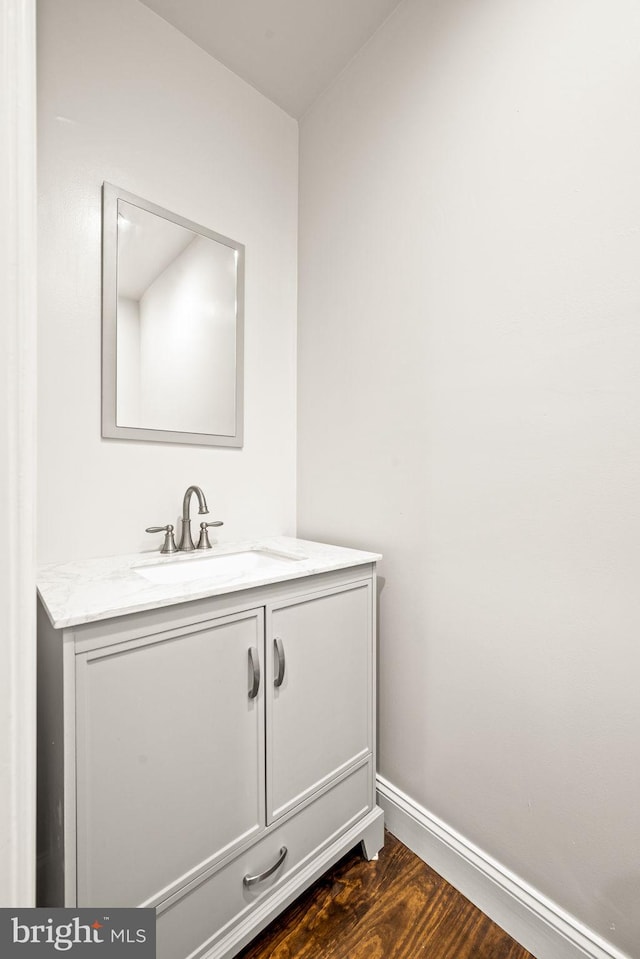 bathroom featuring wood-type flooring and vanity